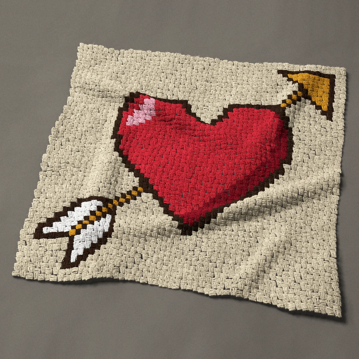 A baby blanket worked corner to corner, 40½ by 40½ inches: Red valentine heart pierced by a golden arrow, 54 by 54 blocks
