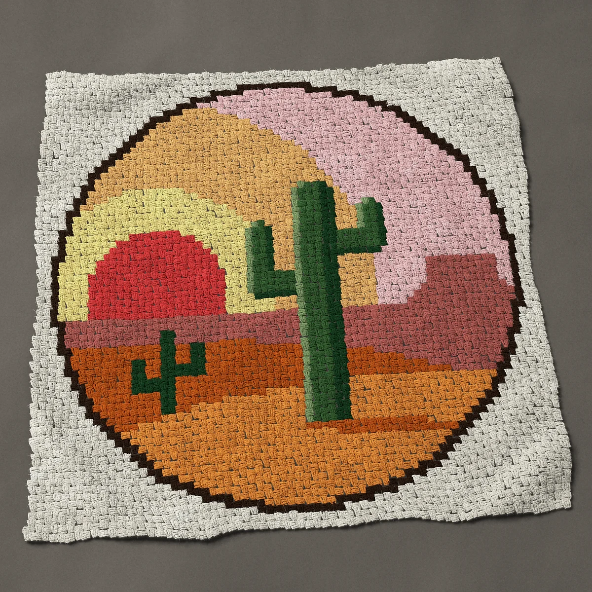 A throw worked corner to corner, 51½ by 51½ inches: Round desert landscape with saguaro cactus and sun, 69 by 69 blocks