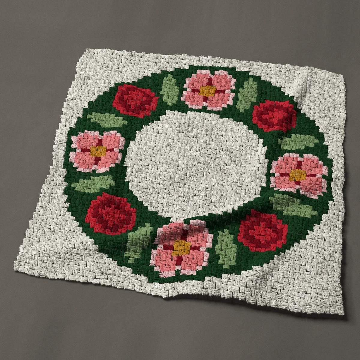 A panel worked corner to corner, 44 by 44 inches: Round floral wreath of pink flowers and red roses, 59 by 59 blocks