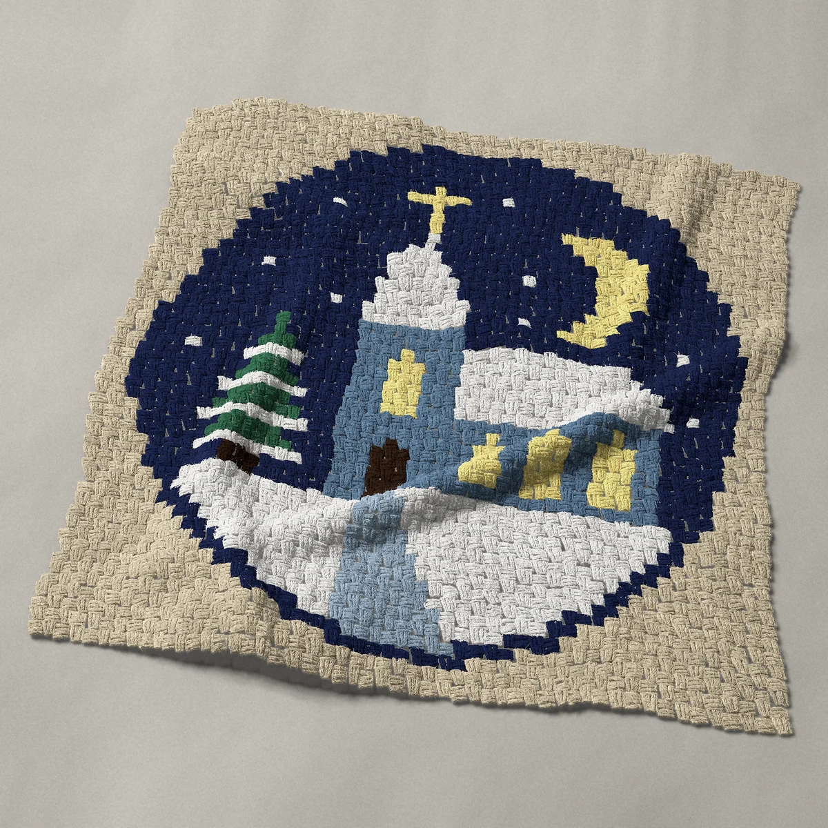 A baby blanket worked corner to corner, 39 by 39 inches: Round snowy winter church at night with lit windows, 52 by 52 blocks