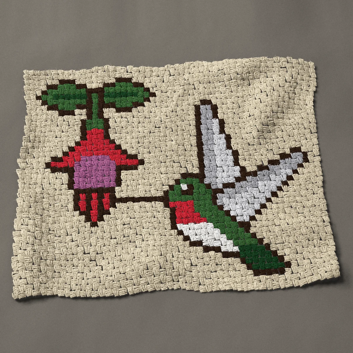 A baby blanket worked corner to corner, 38 by 30¾ inches: Ruby-throated hummingbird at a hanging fuchsia flower, 51 by 41 blocks