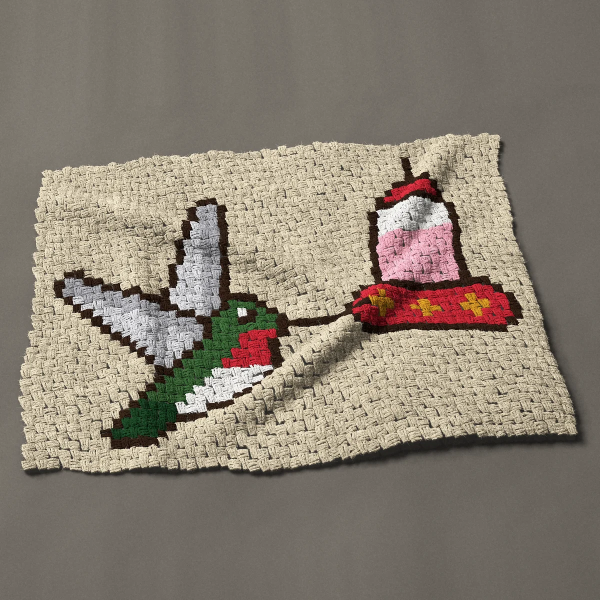 A baby blanket worked corner to corner, 40½ by 30 inches: Ruby-throated hummingbird at a hanging red feeder, 54 by 40 blocks