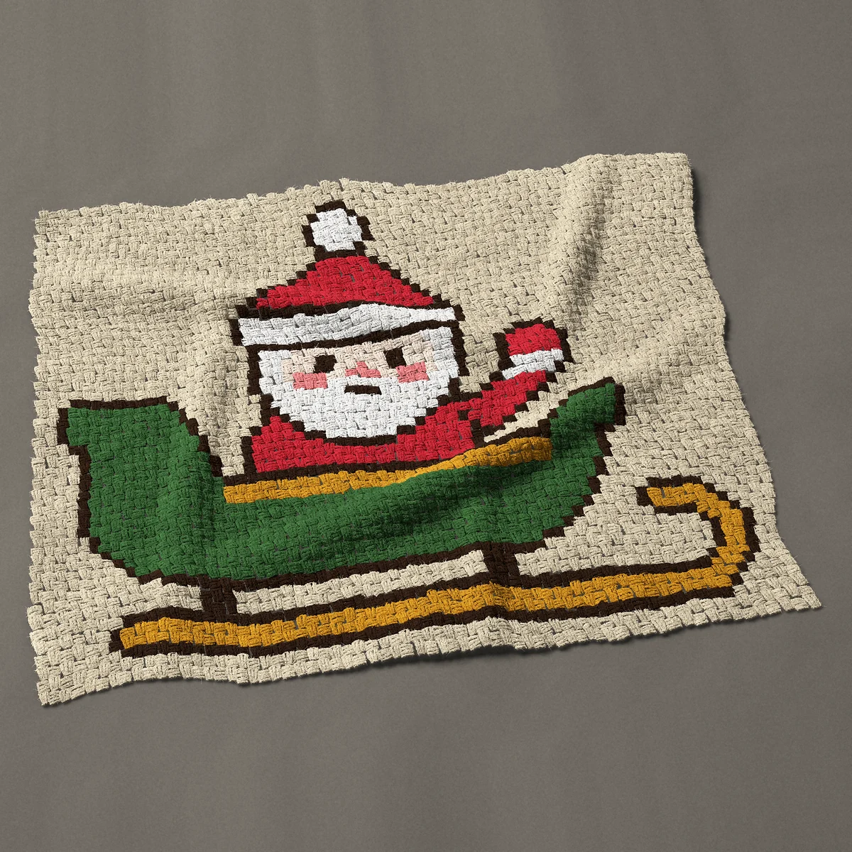 A baby blanket worked corner to corner, 50 by 41 inches: Santa Claus waving from his green sleigh, 67 by 55 blocks