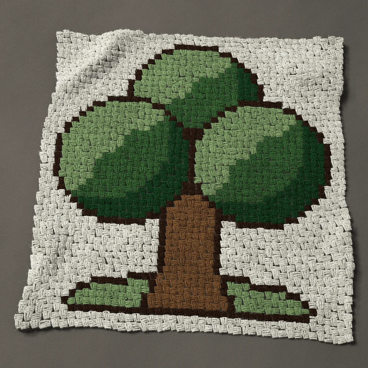 A panel worked corner to corner, 33¾ by 36 inches: Leafy green tree in three shades of green, 45 by 48 blocks