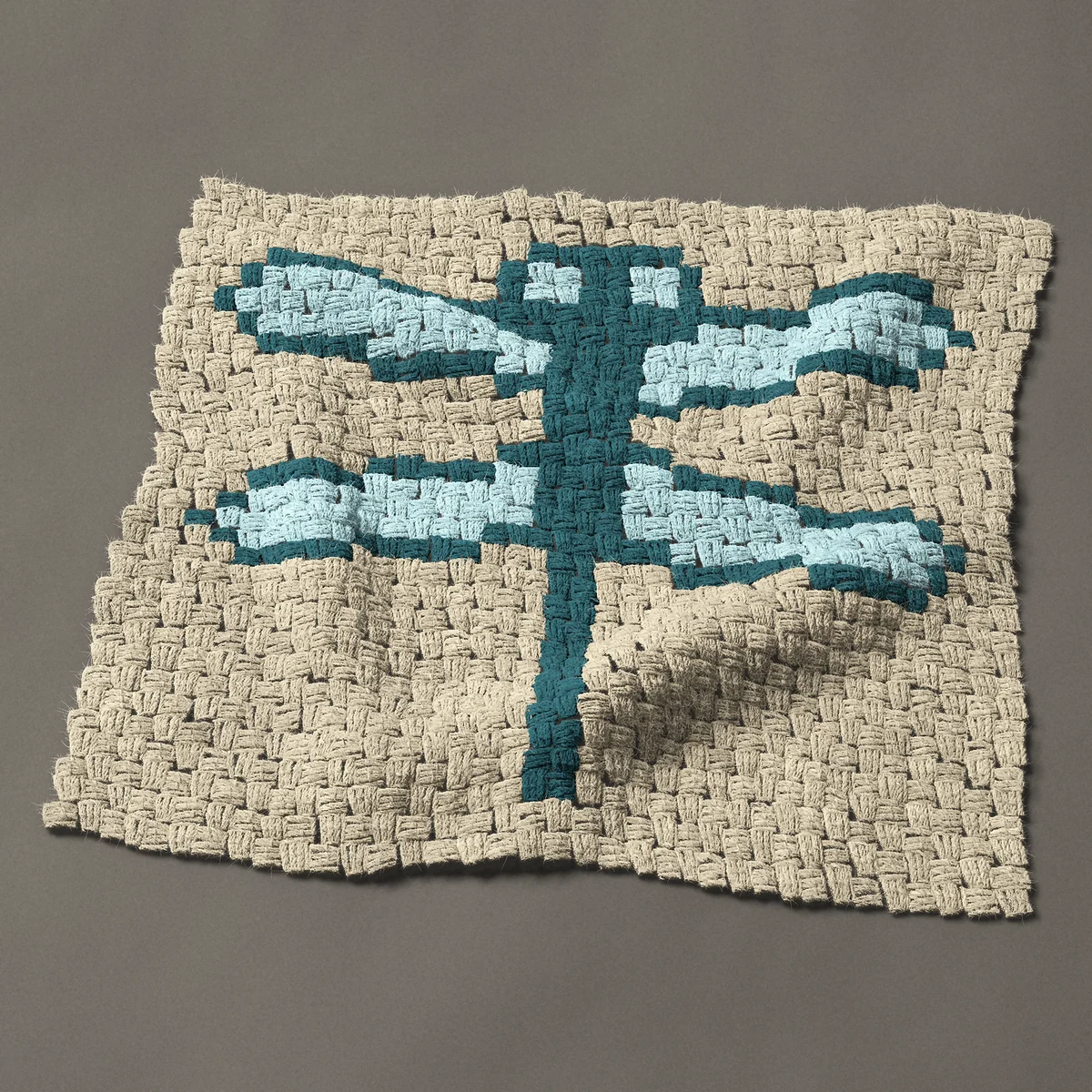 A panel worked corner to corner, 27 by 24 inches: Teal dragonfly in two colors, 36 by 32 blocks