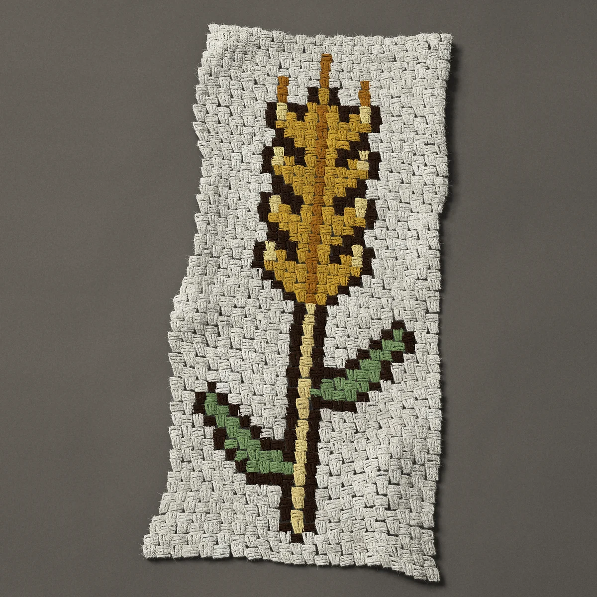 A panel worked corner to corner, 17¼ by 39½ inches: Single golden ear of wheat with two green leaves, 23 by 53 blocks