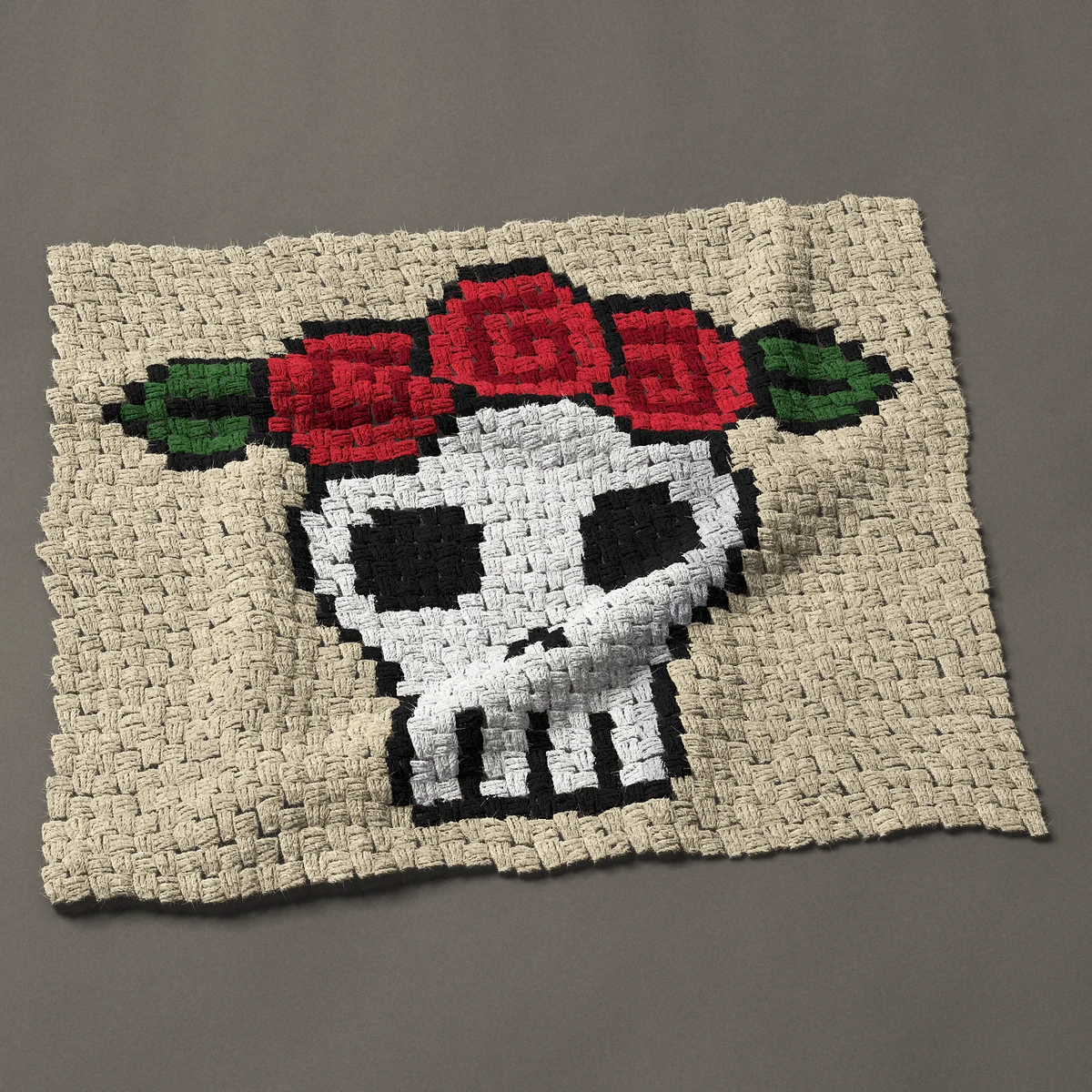 A panel worked corner to corner, 33¾ by 28½ inches: Skull and roses: skull with a crown of red roses, 45 by 38 blocks