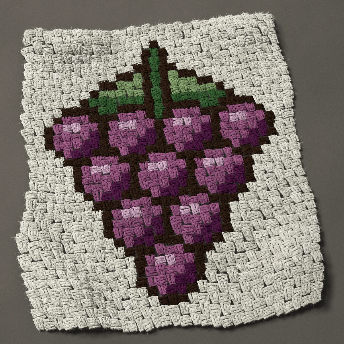 A panel worked corner to corner, 21¾ by 25½ inches: Bunch of purple wine grapes with two leaves, 29 by 34 blocks