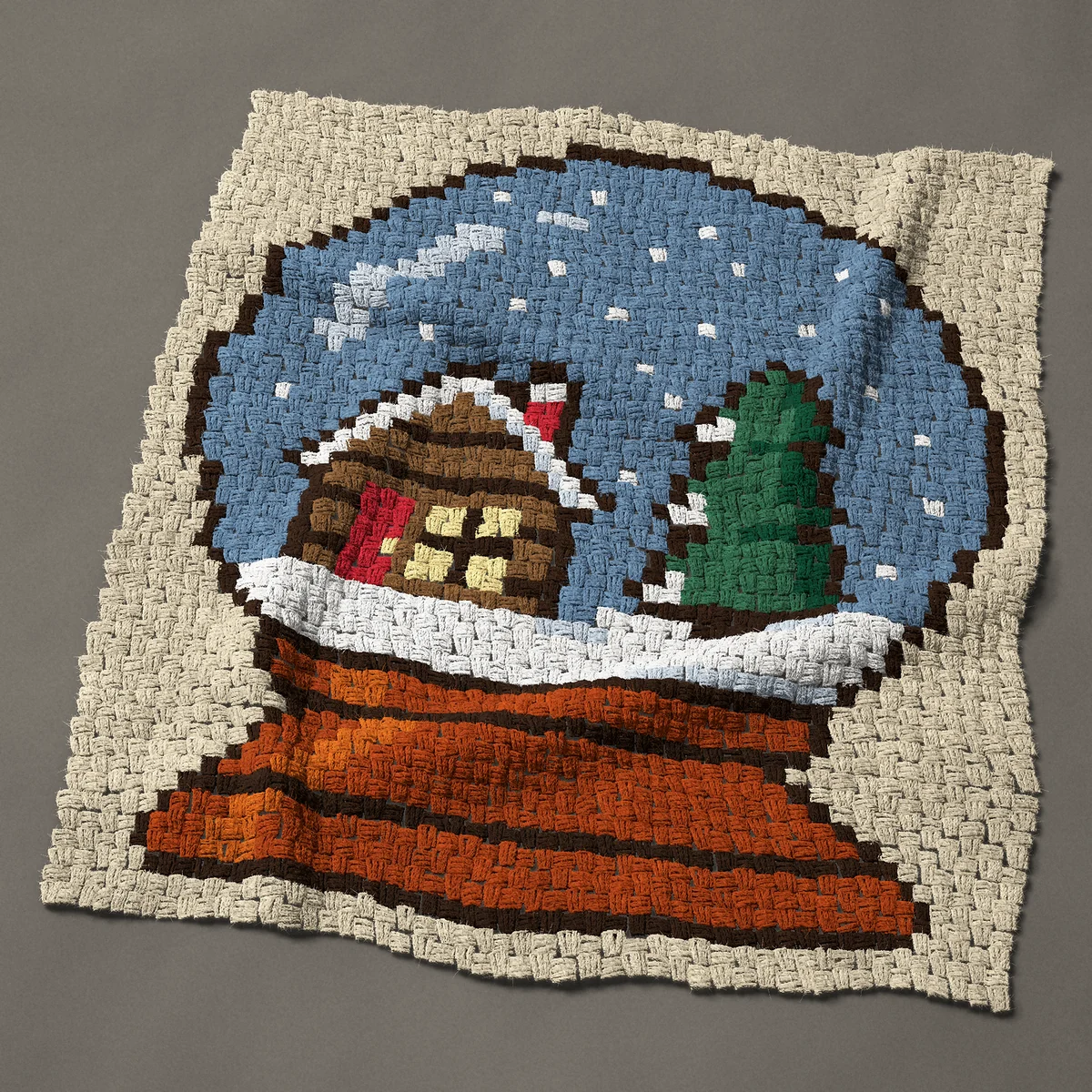 A baby blanket worked corner to corner, 36¾ by 42 inches: Snow globe with a log cabin and pine tree, 49 by 56 blocks