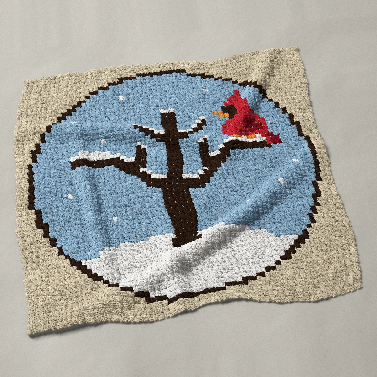 A panel worked corner to corner, 45½ by 45½ inches: Snowy bare winter tree with a red cardinal, round, 61 by 61 blocks