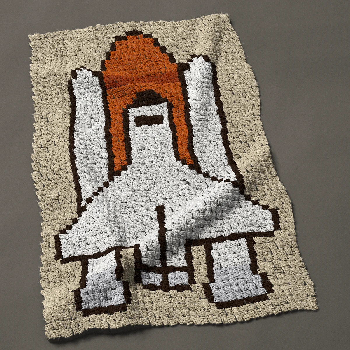 A baby blanket worked corner to corner, 29¼ by 46½ inches: Space shuttle on its orange tank with two boosters, 39 by 62 blocks