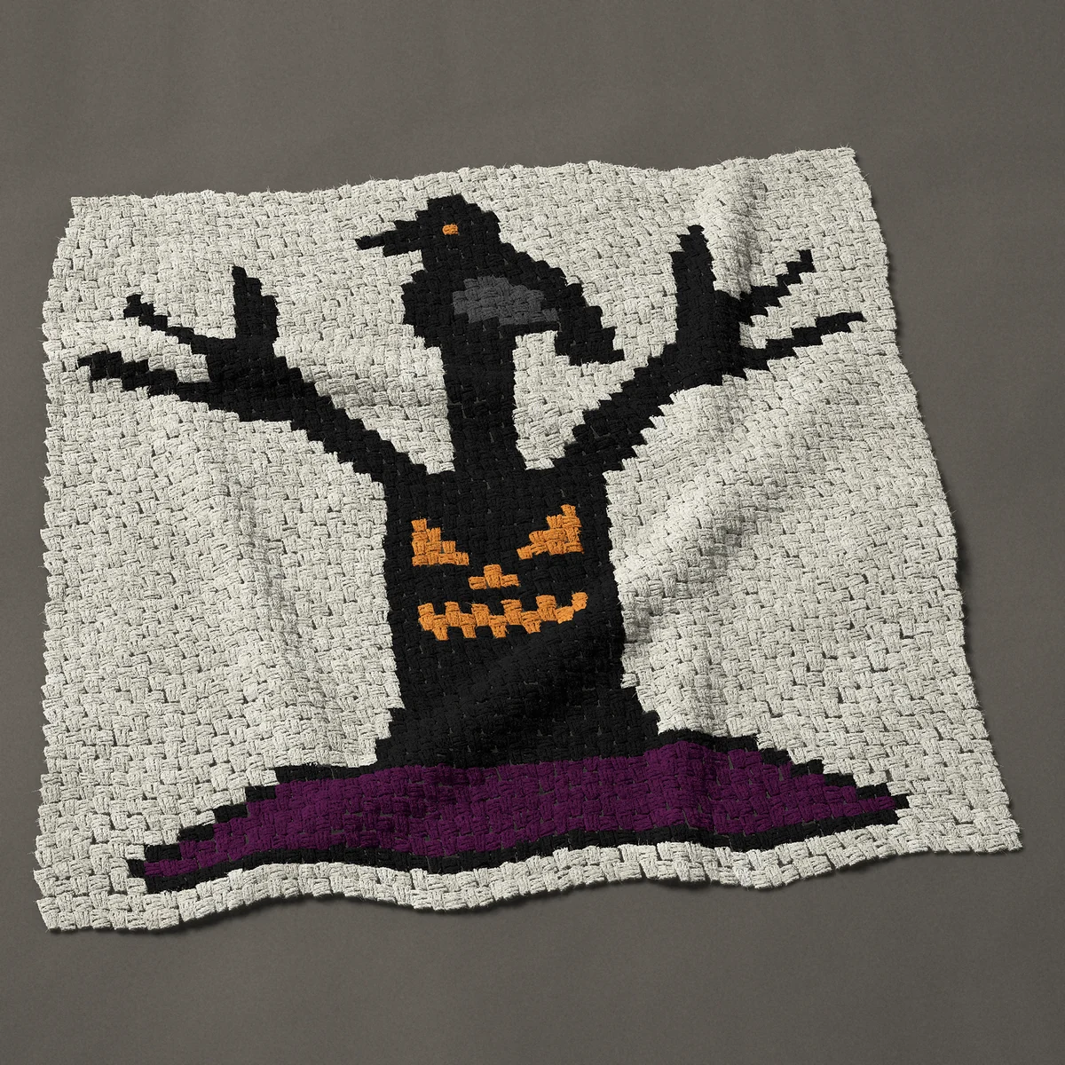 A panel worked corner to corner, 45½ by 45 inches: Spooky Halloween tree with a face and a crow, 61 by 60 blocks