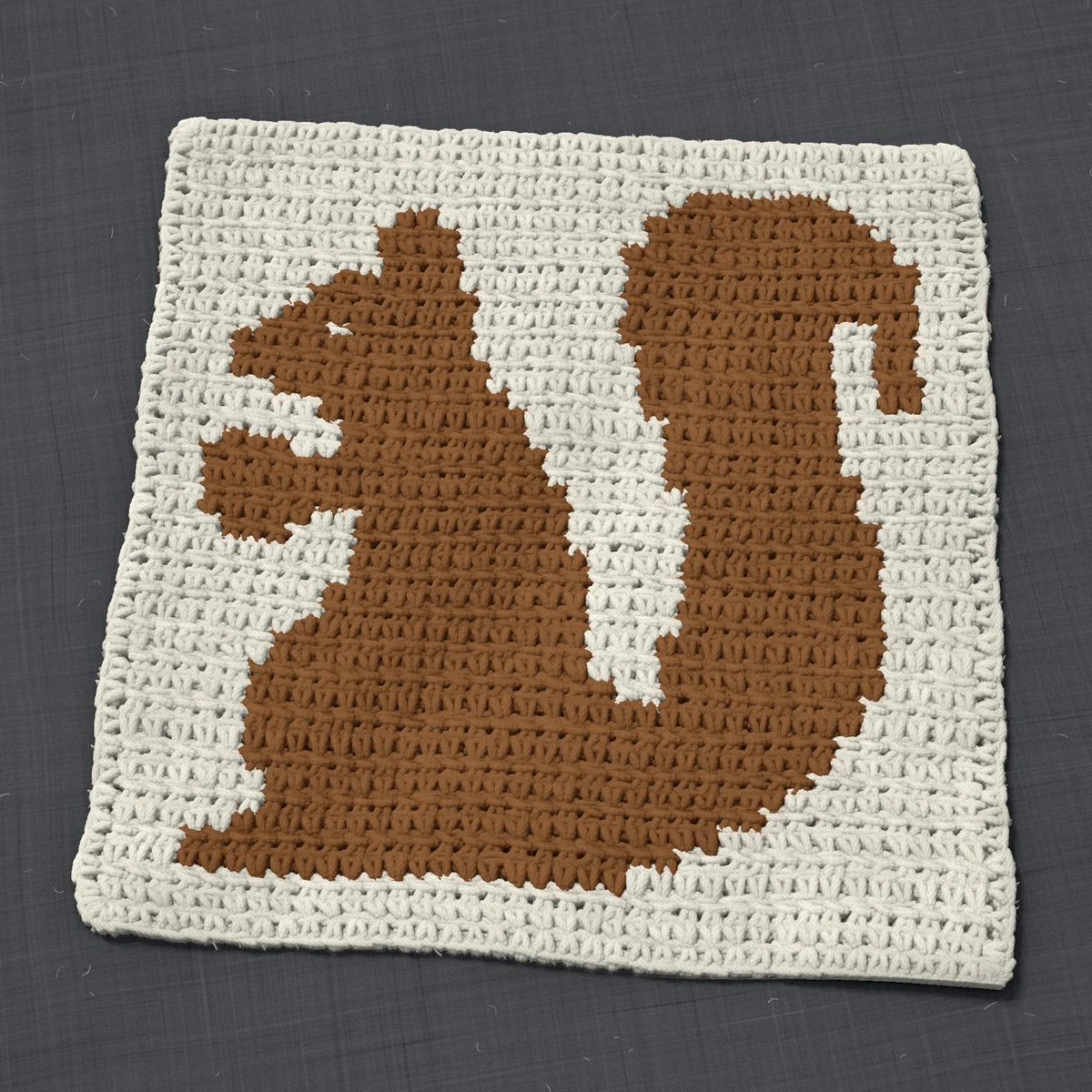 A washcloth in single crochet, 11.4 by 11.5 inches: a squirrel in brown on a cream ground, 37 stitches by 43 rows