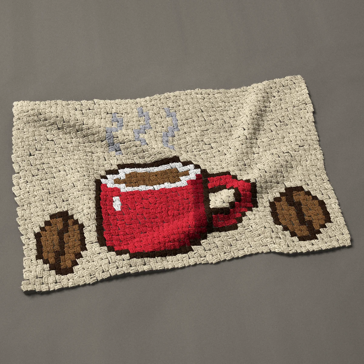 A baby blanket worked corner to corner, 39½ by 27¾ inches: Steaming red coffee mug with two coffee beans, 53 by 37 blocks