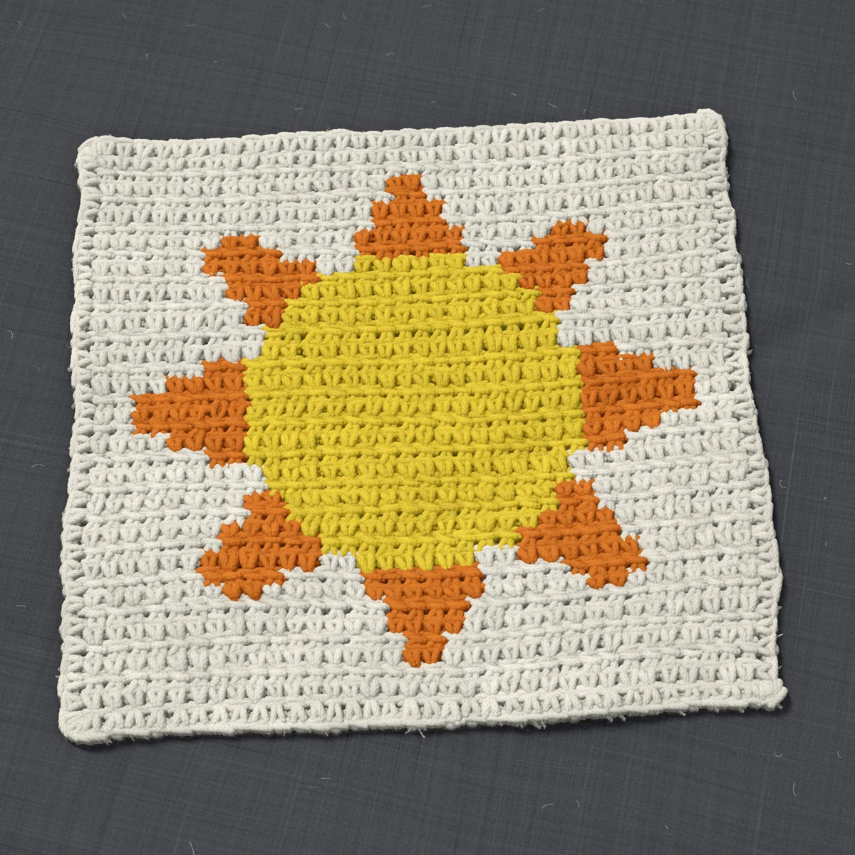 A washcloth in single crochet, 10.5 by 9.9 inches: a sun in yellow and orange on a cream ground, 34 stitches by 37 rows