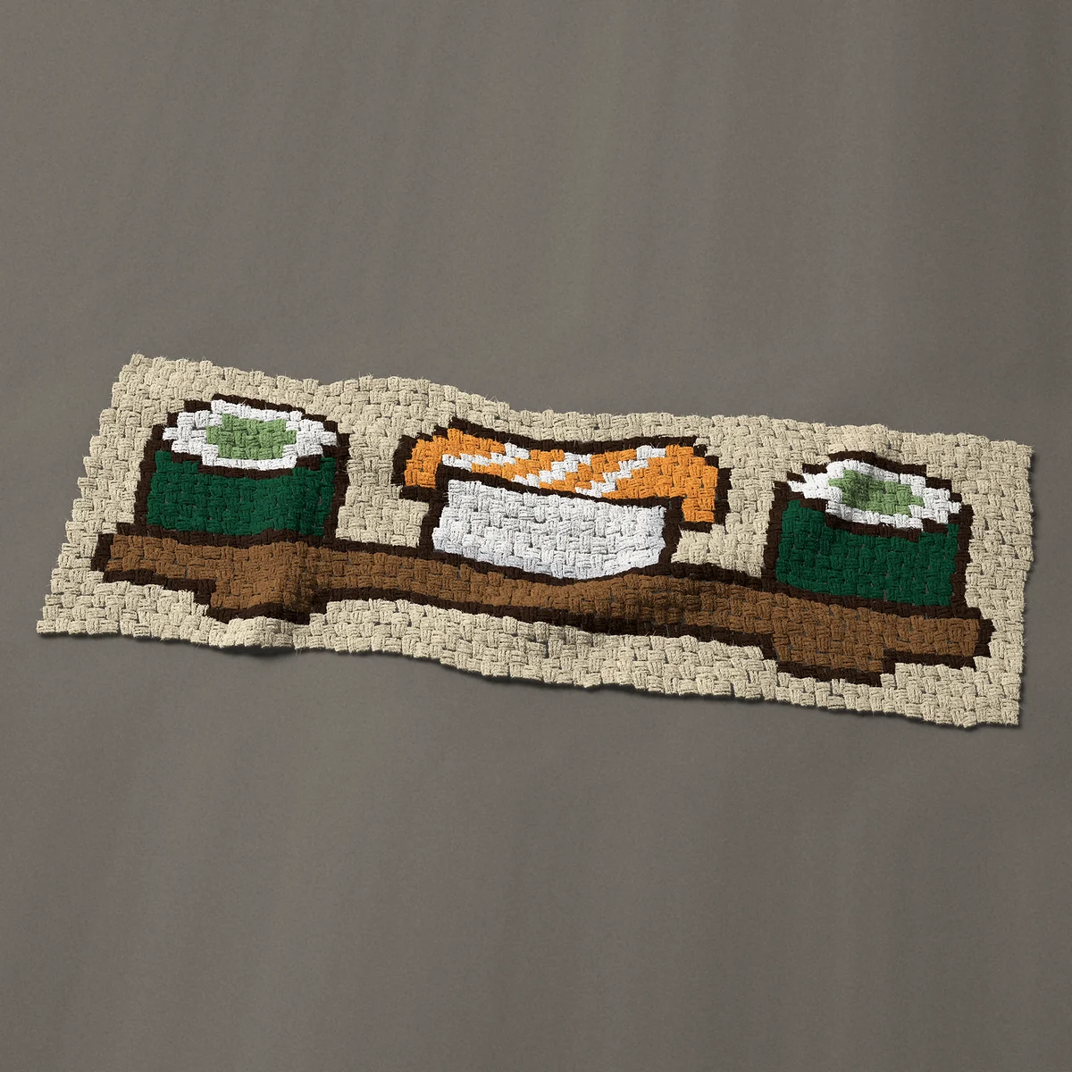 A panel worked corner to corner, 51 by 18 inches: Sushi board with salmon nigiri and two maki rolls, 68 by 24 blocks