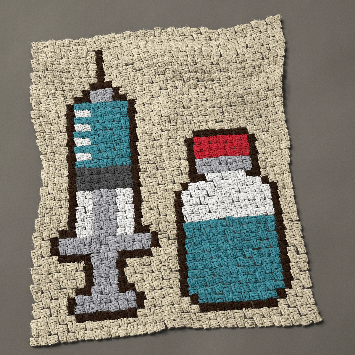 A panel worked corner to corner, 24 by 30 inches: Syringe and medicine vial with a red cap, 32 by 40 blocks