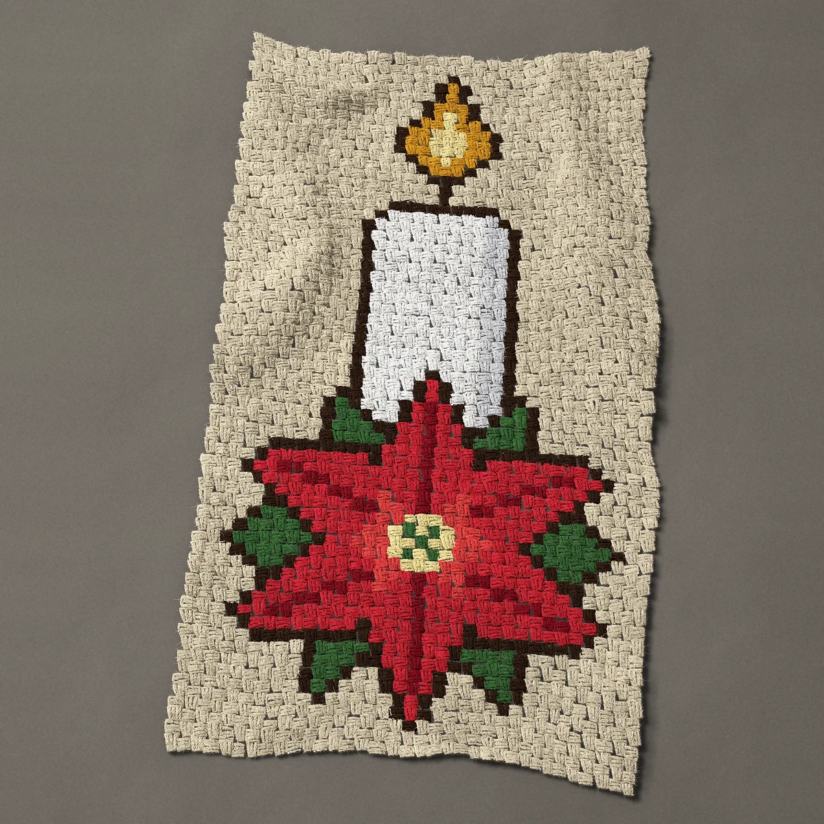 A baby blanket worked corner to corner, 26¼ by 48½ inches: White Christmas candle with a red poinsettia, 35 by 65 blocks