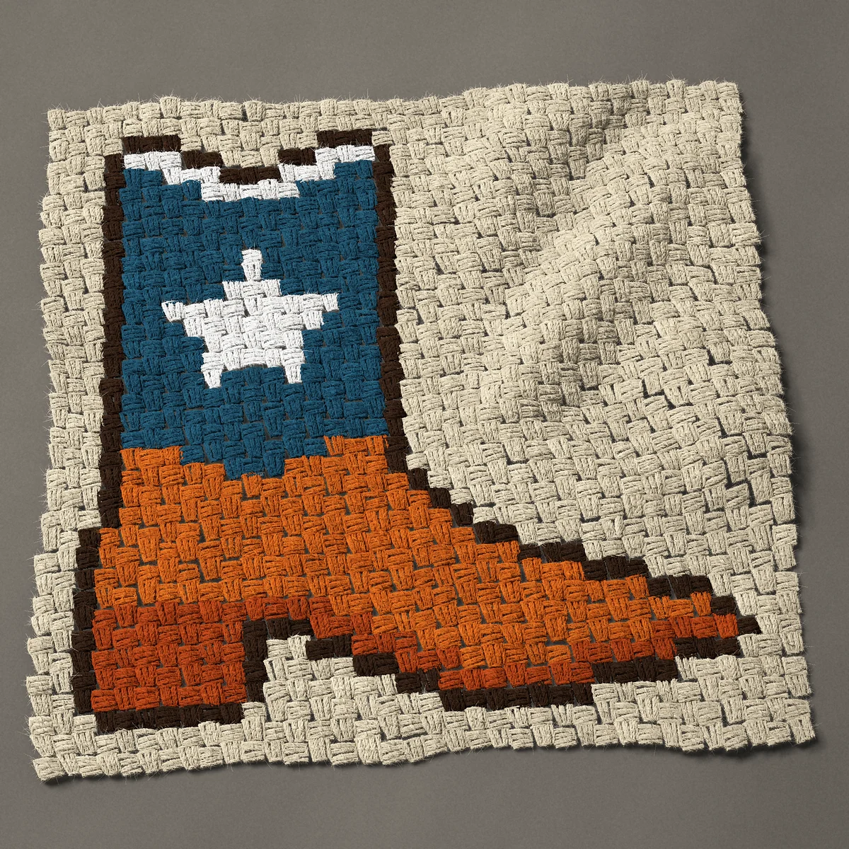 A panel worked corner to corner, 27 by 27 inches: Texas cowboy boot with a white lone star, 36 by 36 blocks