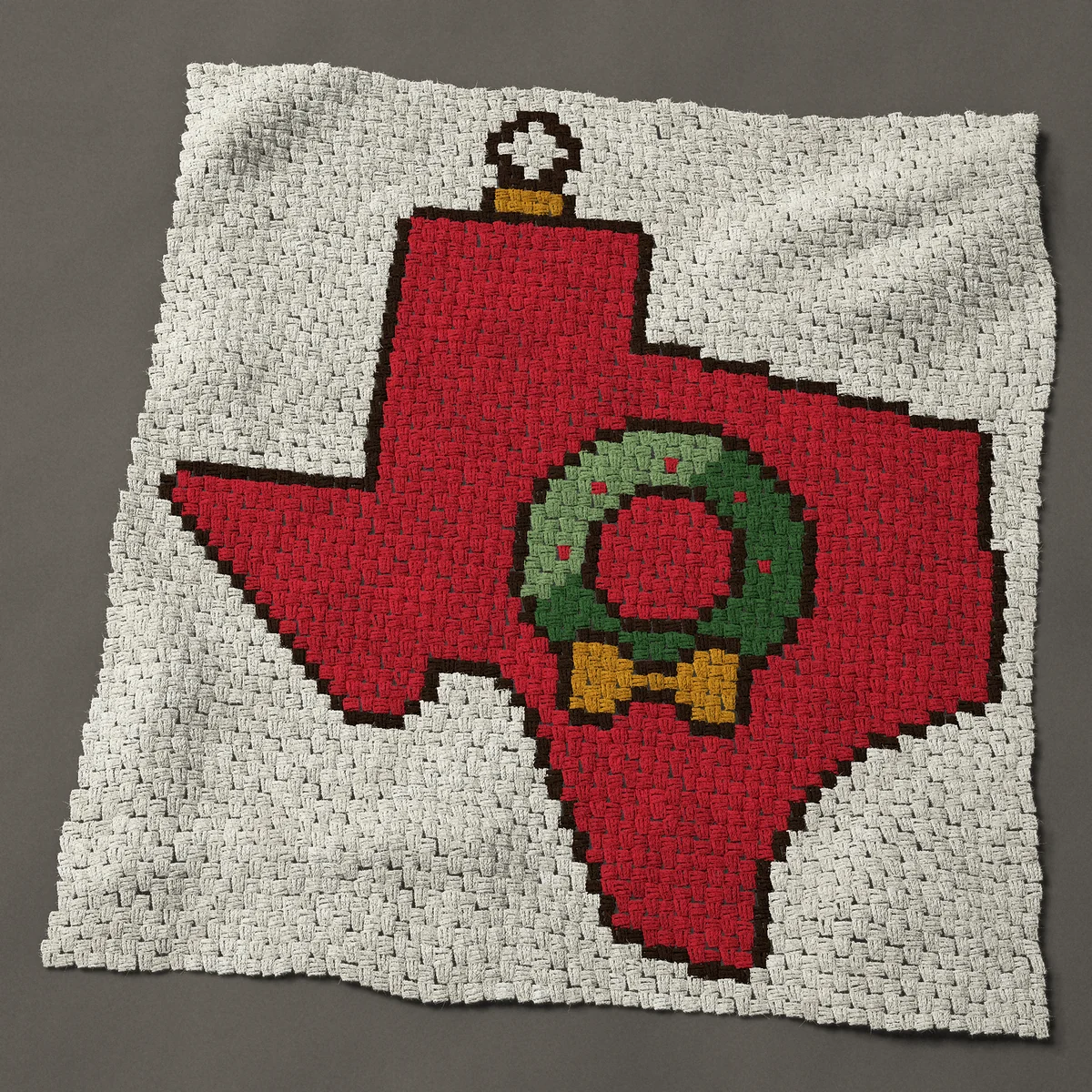 A panel worked corner to corner, 47 by 51 inches: Texas Christmas ornament: state shape with a wreath, 63 by 68 blocks