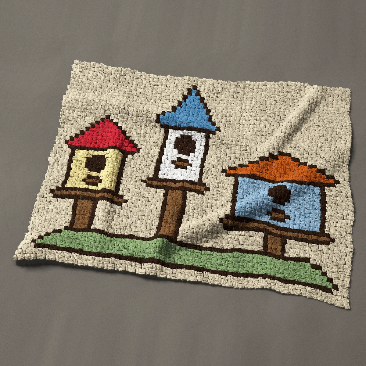 A baby blanket worked corner to corner, 48½ by 41 inches: Three colorful bird houses on wooden posts, 65 by 55 blocks