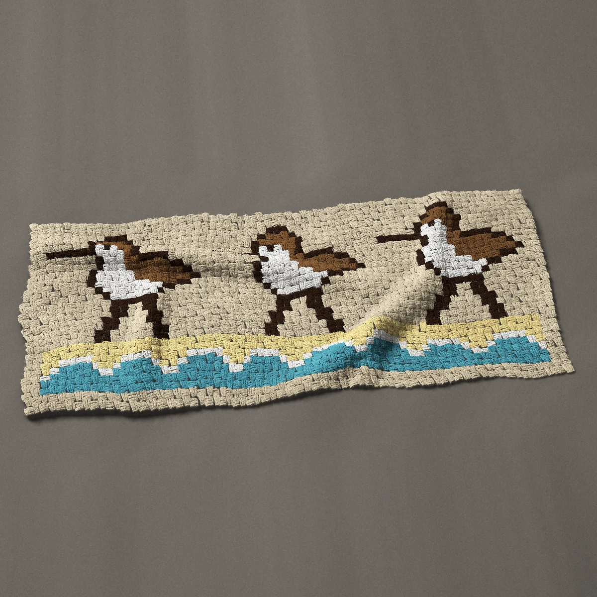A panel worked corner to corner, 51 by 22½ inches: Three sandpipers in a row: shore birds on the beach, 68 by 30 blocks
