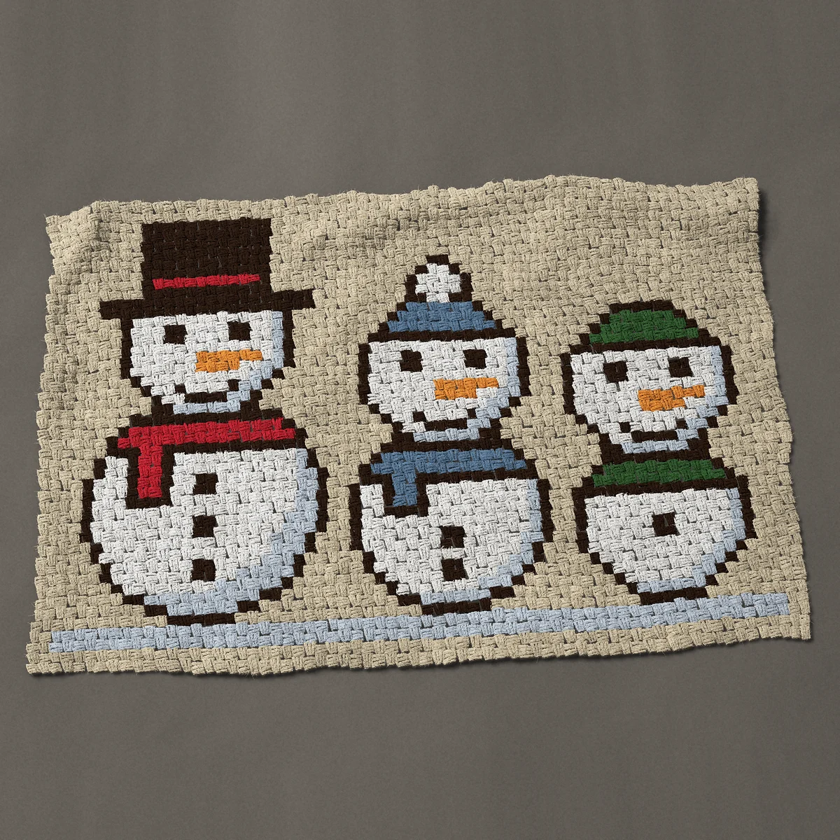 A baby blanket worked corner to corner, 51 by 34½ inches: Snowman trio: three snowmen in hats and scarves, 68 by 46 blocks