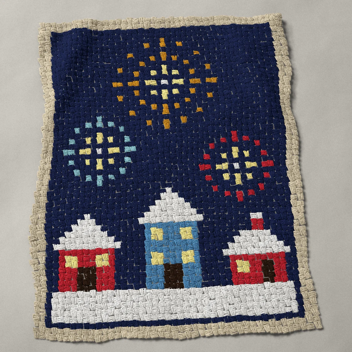 A baby blanket worked corner to corner, 33¾ by 44 inches: New Year's Eve fireworks over three snowy houses, 45 by 59 blocks
