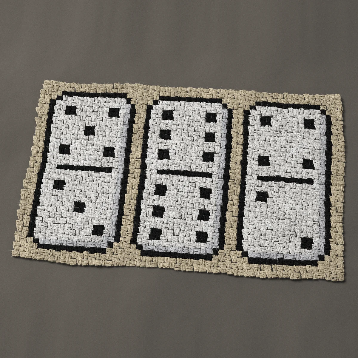 A baby blanket worked corner to corner, 42 by 26¼ inches: Three white dominoes standing in a row, 56 by 35 blocks