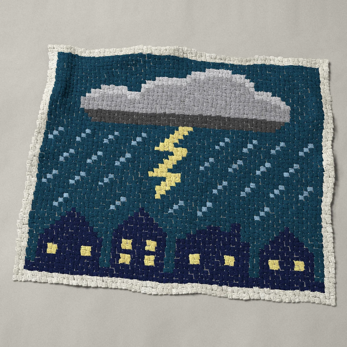 A baby blanket worked corner to corner, 48 by 41 inches: Thunderstorm at night with lightning over rooftops, 64 by 55 blocks