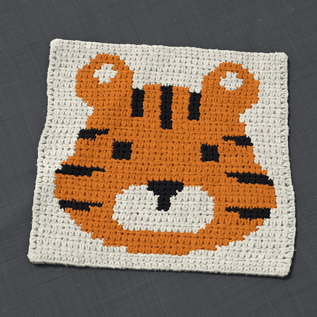 A panel in single crochet, 12.3 by 11.5 inches: a tiger's face in orange and black on a cream ground, 40 stitches by 43 rows