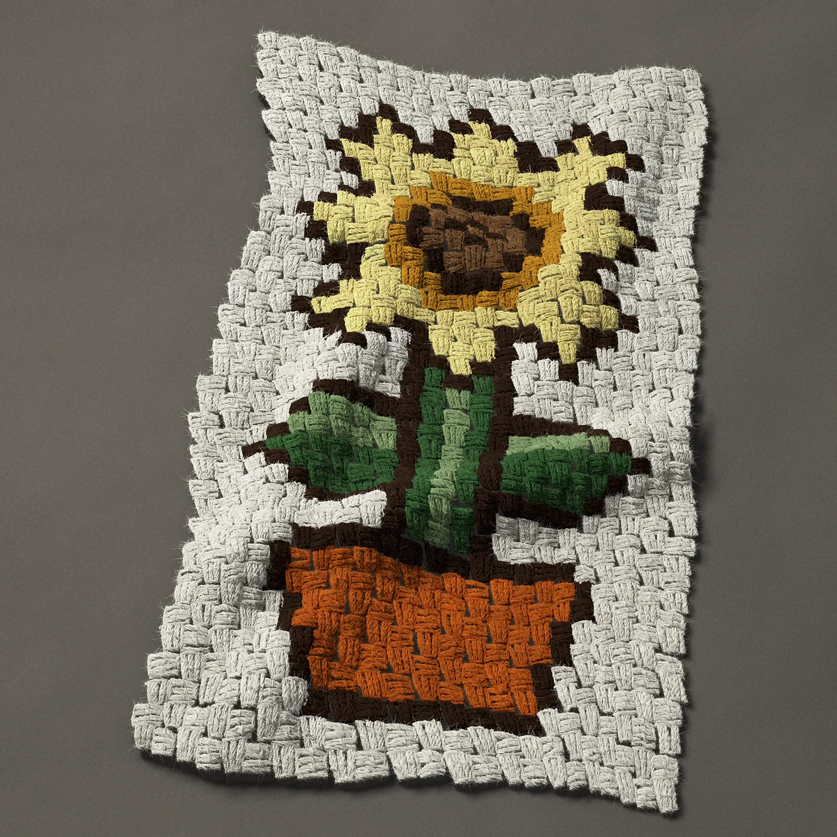 A panel worked corner to corner, 17¼ by 30¾ inches: Sunflower in a terracotta pot, 23 by 41 blocks