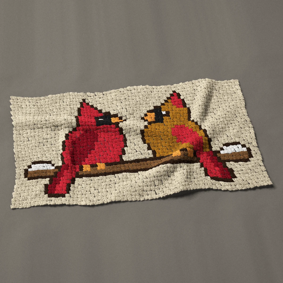 A baby blanket worked corner to corner, 49½ by 27 inches: Two cardinals, male and female, on a snowy branch, 66 by 36 blocks