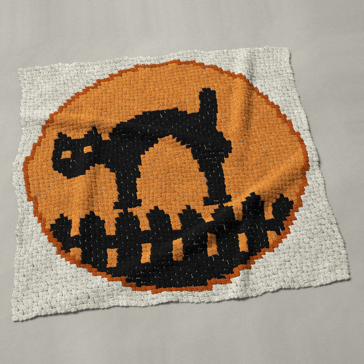 A throw worked corner to corner, 51 by 51 inches: Vintage Halloween black cat on a fence with full moon, 68 by 68 blocks