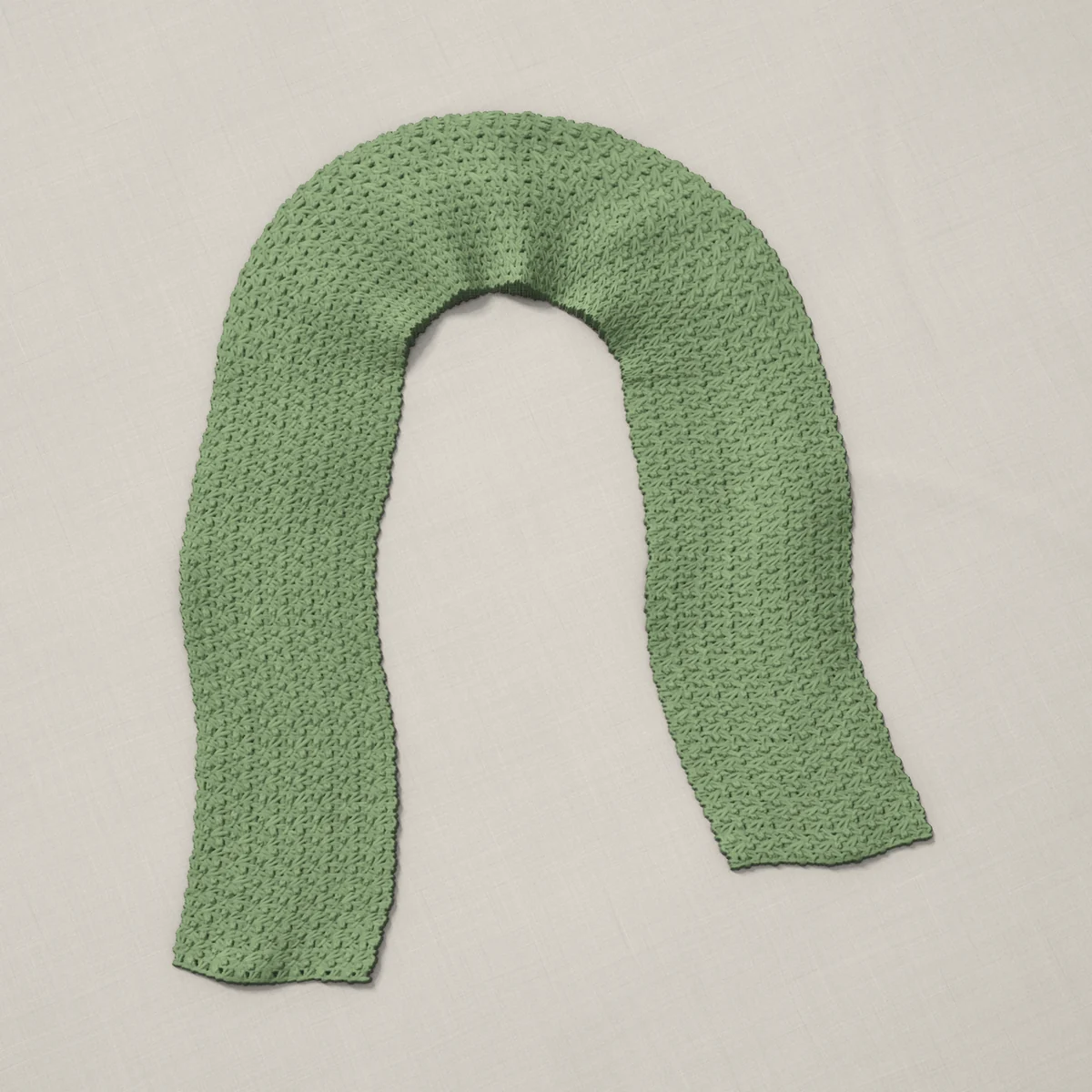 A scarf in wattle stitch, 6.8 by 60.2 inches, lying in a loose bend