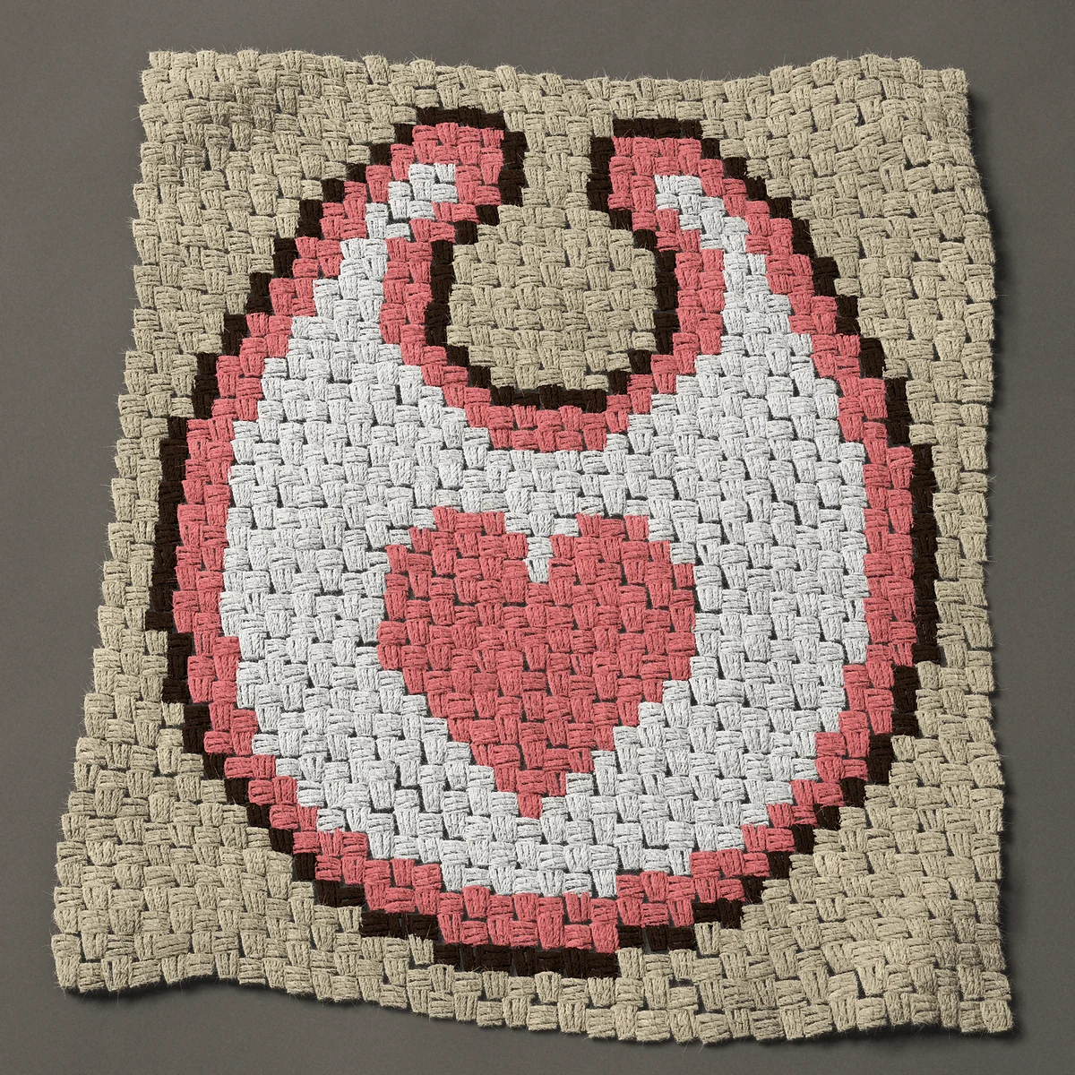 A panel worked corner to corner, 27¾ by 32¼ inches: White baby bib with a pink heart for a baby girl, 37 by 43 blocks