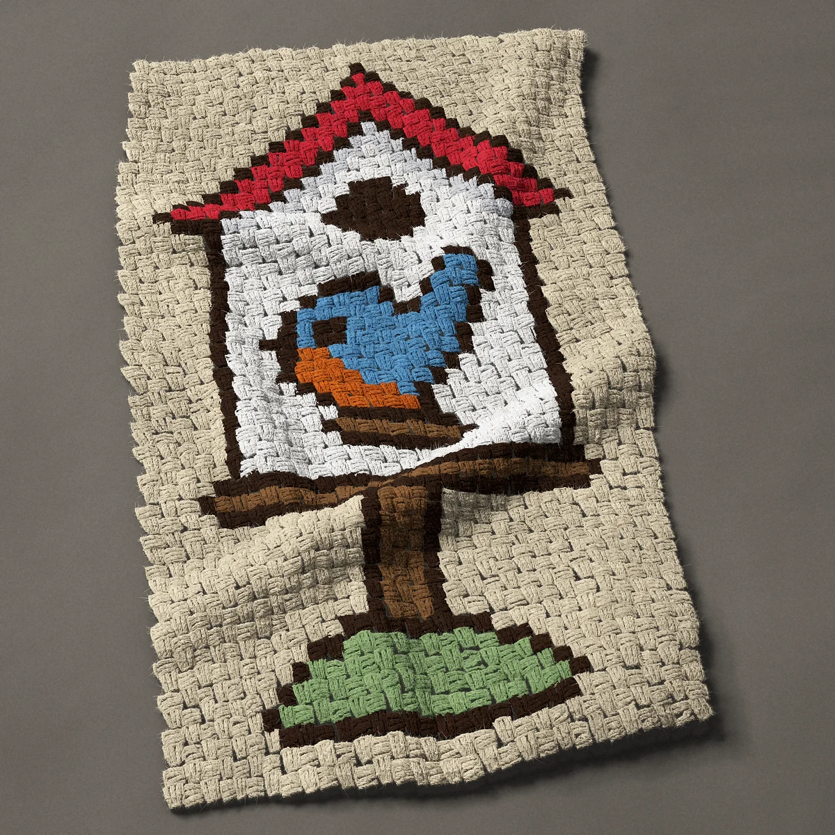 A panel worked corner to corner, 23¼ by 41 inches: White bird house with a red roof and a bluebird, 31 by 55 blocks