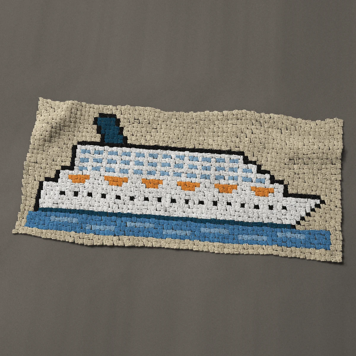 A panel worked corner to corner, 51 by 24 inches: White cruise ship with orange lifeboats, side view, 68 by 32 blocks
