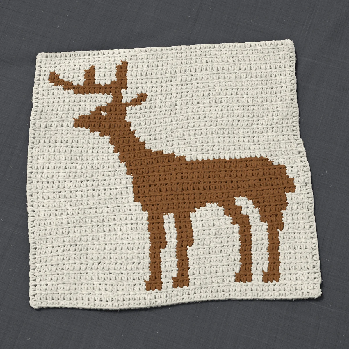 A pillow front in single crochet, 15.1 by 14.9 inches: a whitetail buck in brown on a cream ground, 49 stitches by 56 rows