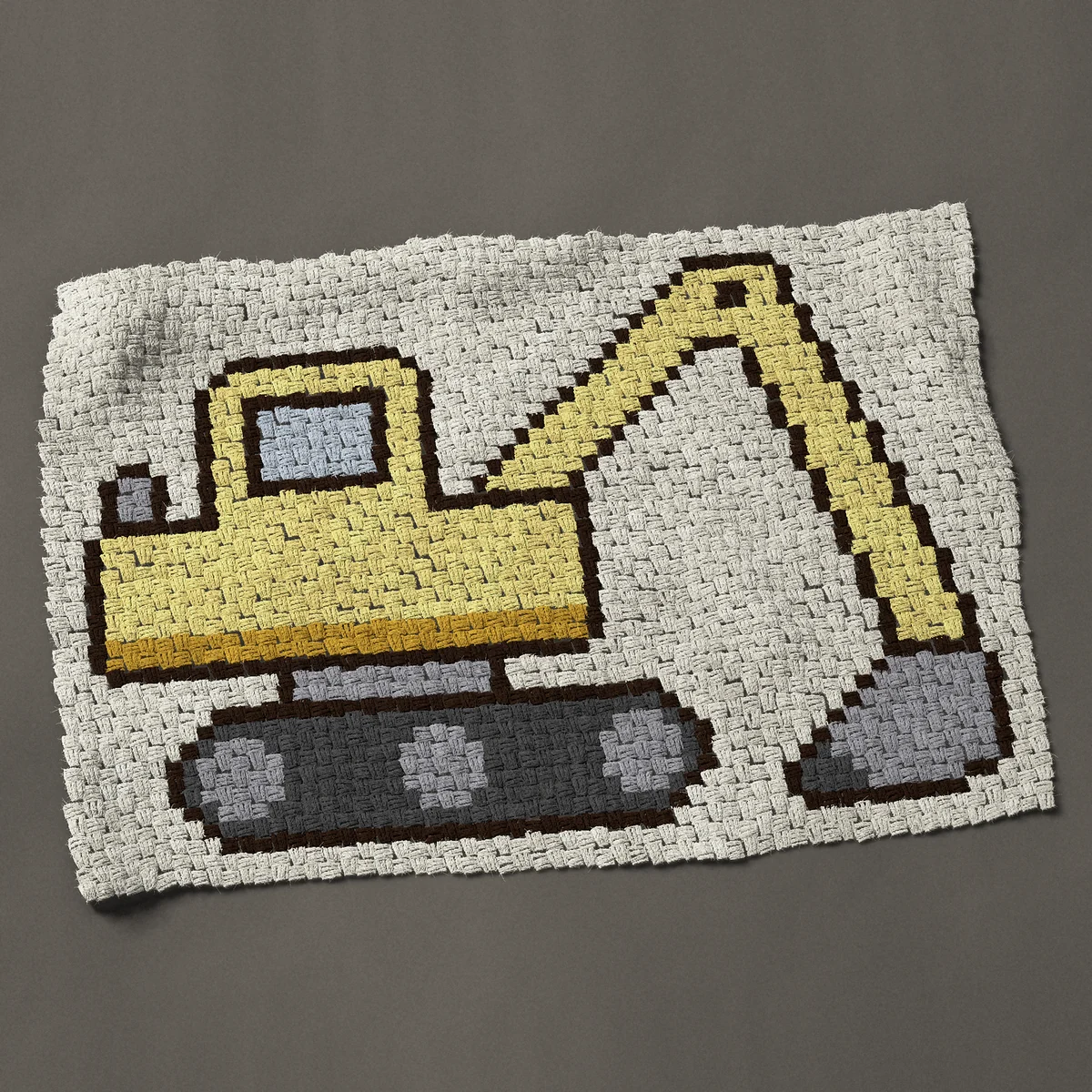 A baby blanket worked corner to corner, 44 by 31½ inches: Yellow excavator digger, a construction vehicle, 59 by 42 blocks