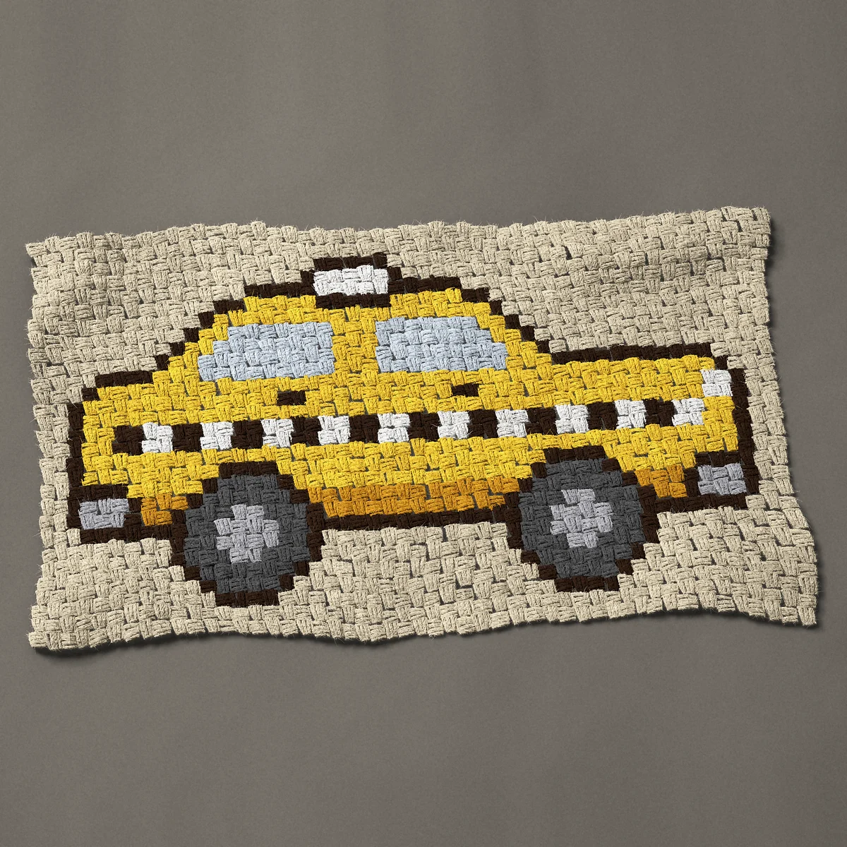 A panel worked corner to corner, 37½ by 21¾ inches: Yellow New York taxi cab with a checker stripe, 50 by 29 blocks