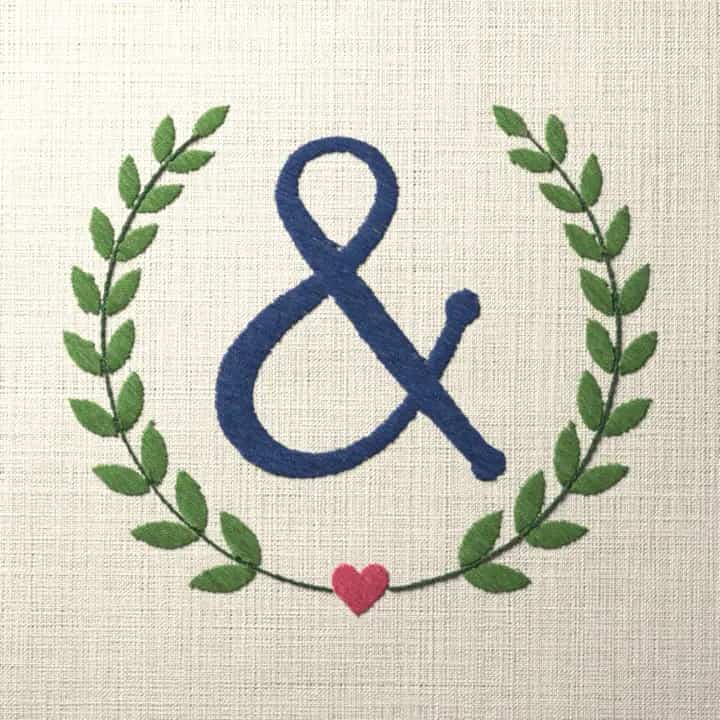 Ampersand in a laurel wreath: preview of the stitched design