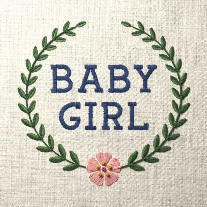 Baby girl in laurel: preview of the stitched design