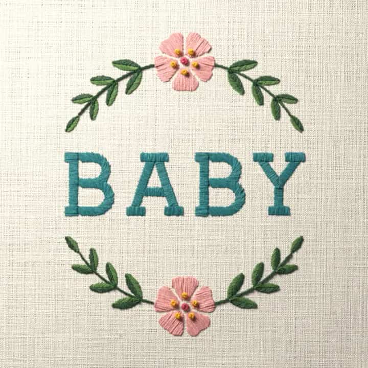 Baby in laurel: preview of the stitched design