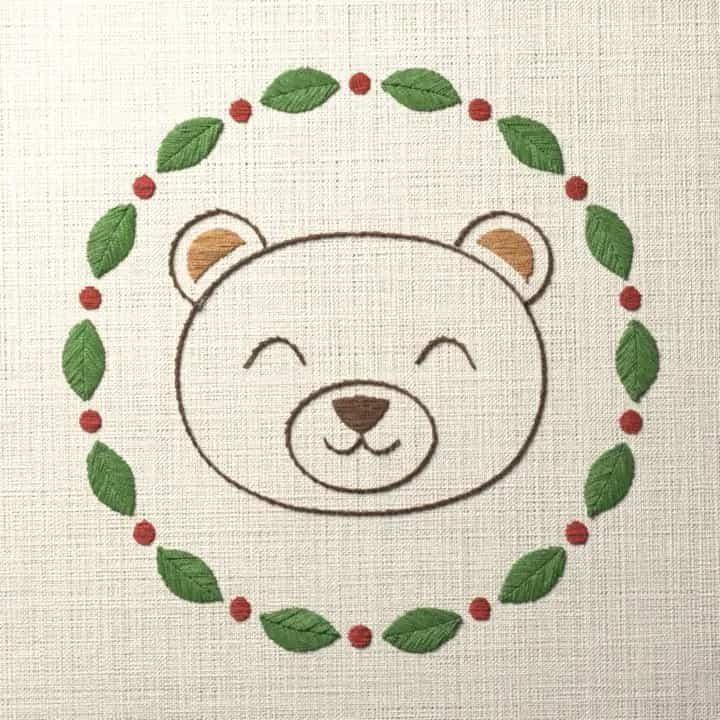 Bear face in a leaf ring: preview of the stitched design