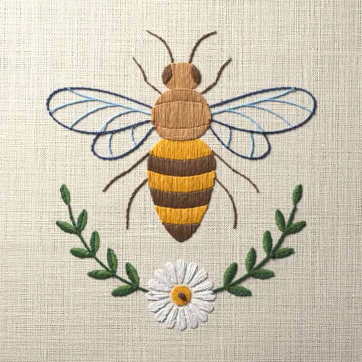 Bee over daisy crescent: preview of the stitched design