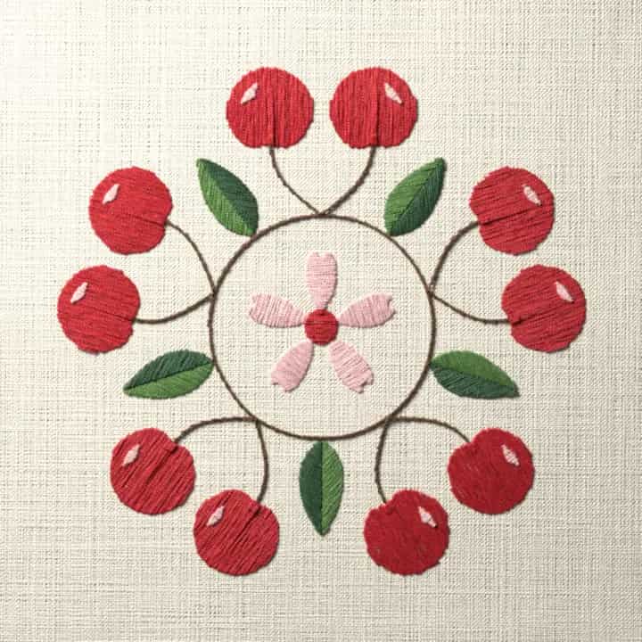 Cherry wreath with a blossom: preview of the stitched design