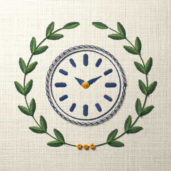 Clock face in a laurel wreath: preview of the stitched design