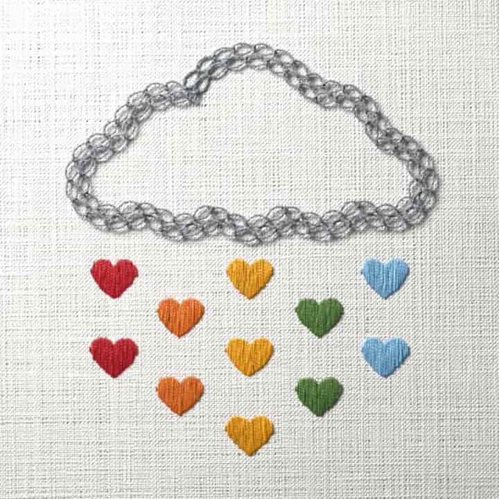 Cloud raining rainbow hearts: preview of the stitched design