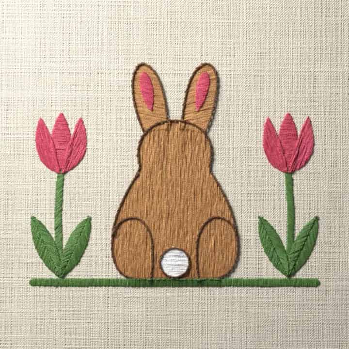 Cottontail rabbit between two tulips: preview of the stitched design